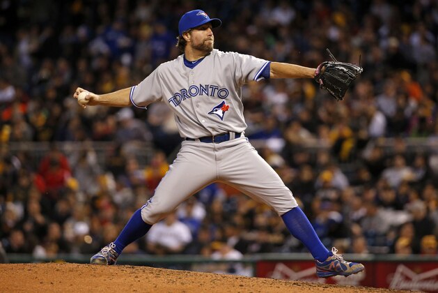 Toronto Blue Jays starting pitcher R.A. Dickey delivers during the fourth inning of a baseball game against the Pittsburgh Pirates in Pittsburgh, Saturday, May 3, 2014. (AP Photo/Gene J. Puskar)