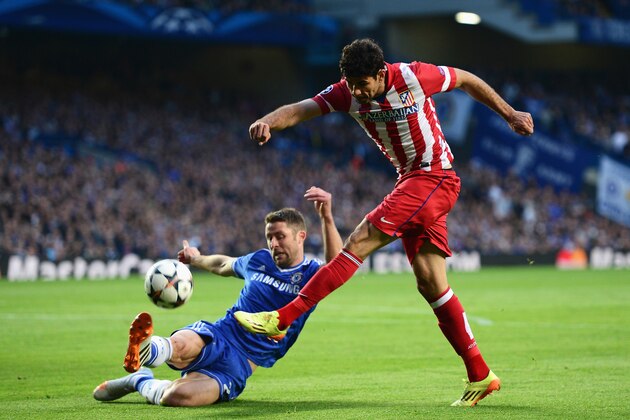 LONDON, ENGLAND - APRIL 30: Diego Costa of Club Atletico de Madrid shoots at goal under a challenge by Gary Cahill of Chelsea during the UEFA Champions League semi-final second leg match between Chelsea and Club Atletico de Madrid at Stamford Bridge on April 30, 2014 in London, England.  (Photo by Jamie McDonald/Getty Images)