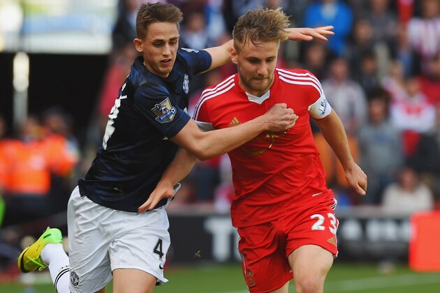 SOUTHAMPTON, ENGLAND - MAY 11:  (L-R) Adnan Januzaj of Manchester United and Luke Shaw of Southampton challenge for the ball during the Barclays Premier League match between Southampton and Manchester United at St Mary's Stadium on May 11, 2014 in Southampton, England.  (Photo by Mike Hewitt/Getty Images)