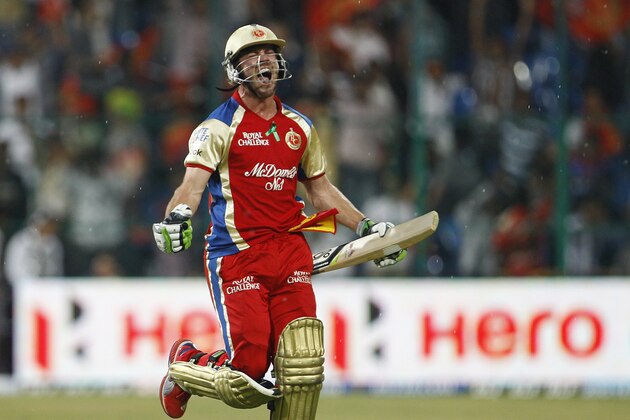 Royal Challengers Bangalore batsman AB de Villiers celebrates their win over Pune Warriors in the Indian Premier League (IPL) cricket match in Bangalore, India, Tuesday, April 17, 2012. Royal Challengers Bangalore won the match by six wickets. (AP Photo/Aijaz Rahi)
