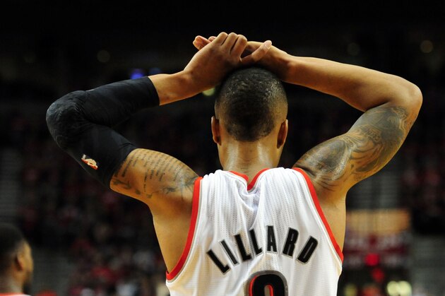 PORTLAND, OR - MAY 10: Damian Lillard #0 of the Portland Trail Blazers reacts to an officials call in the second half of Game Three of the Western Conference Semifinals against the San Antonio Spurs during the 2014 NBA Playoffs at the Moda Center on May 10, 2014 in Portland, Oregon. The Spurs won the game 118-103. NOTE TO USER: User expressly acknowledges and agrees that, by downloading and or using this photograph, User is consenting to the terms and conditions of the Getty Images License Agreement. (Photo by Steve Dykes/Getty Images)