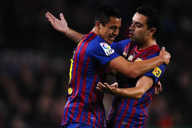BARCELONA, SPAIN - APRIL 10:  Alexis Sanchez of FC Barcelona (L) celebrates with his teammate Xavi Hernandez of FC Barcelona after scoring the opening goal lduring the La Liga match between FC Barcelona and Getafe CF at Camp Nou on April 10, 2012 in Barcelona, Spain.  (Photo by David Ramos/Getty Images)