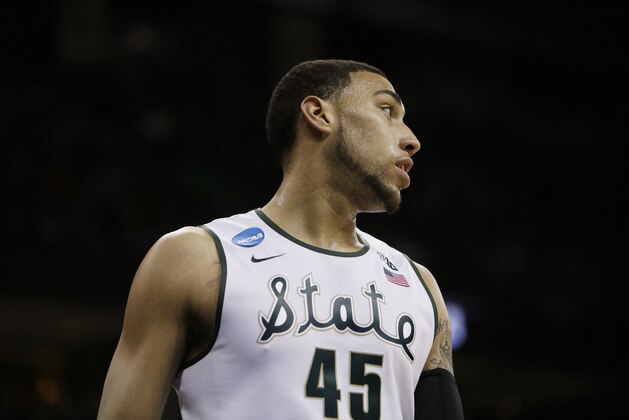 Michigan State’s Denzel Valentine (45) looks down court during a break in action during the third-round game of the NCAA men's college basketball tournament against Harvard in Spokane, Wash., Saturday, March 22, 2014.(AP Photo/Young Kwak)