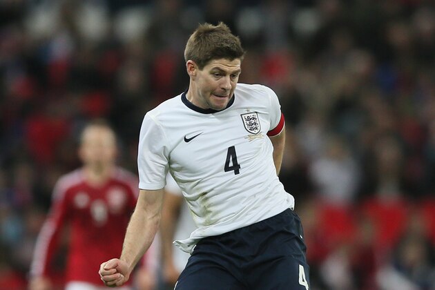 England's Steven Gerrard passes the ball during the international friendly soccer match between England and Denmark at Wembley stadium in London Wednesday, March 5,  2014. (AP Photo/Alastair Grant)