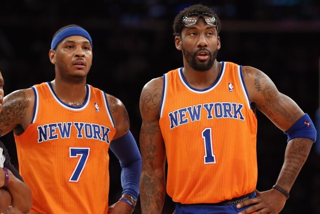 NEW YORK, NY - DECEMBER 08: Carmelo Anthony #7 and Amar'e Stoudemire #1 of the New York Knicks wait for play to resume during the second quarter against the Boston Celtics at Madison Square Garden on December 8, 2013 in New York City. NOTE TO USER: User expressly acknowledges and agrees that, by downloading and or using this Photograph, user is consenting to the terms and conditions of the Getty Images License Agreement.  (Photo by Bruce Bennett/Getty Images)