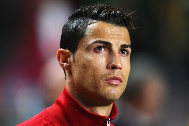 LISBON, PORTUGAL - NOVEMBER 15:  Cristiano Ronaldo of Portugal looks focussed during the National Anthems ahead of the FIFA 2014 World Cup Qualifier Play-off First Leg between Portugal and Sweden at Estadio da Luz on November 15, 2013 in Lisbon, Portugal.  (Photo by Mike Hewitt/Getty Images)