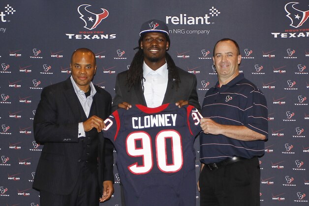 HOUSTON, TX - MAY 09:  Jadeveon Clowney (C) displays his Houston Texans jersey with general manager Rick Smith (L) and Houston Texans head coach Bill O'Brien (R) at Reliant Stadium on May 9, 2014 in Houston, Texas. Clowney was selected by the Texans with the first overall pick in the 2014 NFL draft. (Photo by Bob Levey/Getty Images)