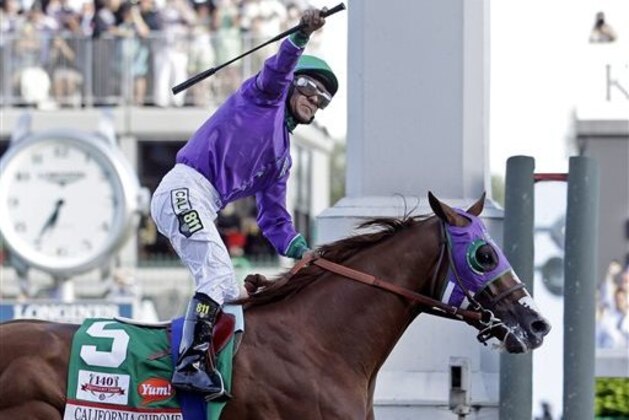 FILE - In this May 3, 2014, file photo, jockey Victor Espinoza celebrates aboard California Chrome after winning the 140th running of the Kentucky Derby horse race at Churchill Downs in Louisville, Ky. The California colt will be running in the Preakness with a bulls-eye on his back as perhaps racing's next superstar. He figures to face eight or nine rivals in the middle leg of the Triple Crown series, and one of them might be a filly.  (AP Photo/Morry Gash, File)