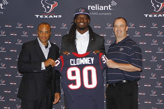 HOUSTON, TX - MAY 09:  Jadeveon Clowney (C) displays his Houston Texans jersey with general manager Rick Smith (L) and Houston Texans head coach Bill O'Brien (R) at Reliant Stadium on May 9, 2014 in Houston, Texas. Clowney was selected by the Texans with the first overall pick in the 2014 NFL draft. (Photo by Bob Levey/Getty Images)