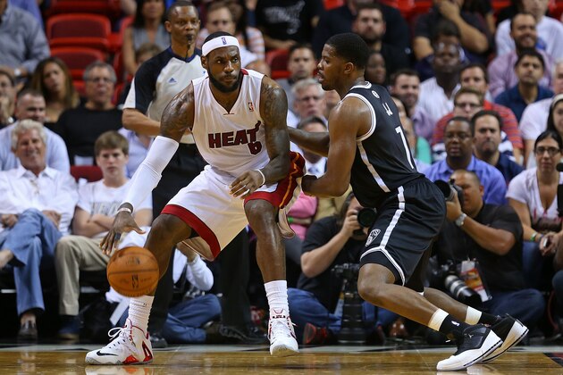 MIAMI, FL - MARCH 12:  LeBron James #6 of the Miami Heat posts up Joe Johnson #7 of the Brooklyn Nets during a game  at American Airlines Arena on March 12, 2014 in Miami, Florida. NOTE TO USER: User expressly acknowledges and agrees that, by downloading and/or using this photograph, user is consenting to the terms and conditions of the Getty Images License Agreement. Mandatory copyright notice:  (Photo by Mike Ehrmann/Getty Images)