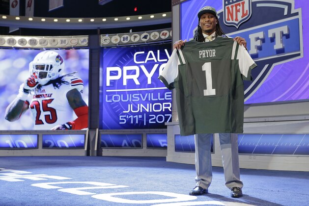 Louisville free safety Calvin Pryor poses with NFL commissioner Roger Goodell after being selected by the New York Jets as 18th pick in the the first round of the 2014 NFL Draft, Thursday, May 8, 2014, in New York. (AP Photo/Craig Ruttle)