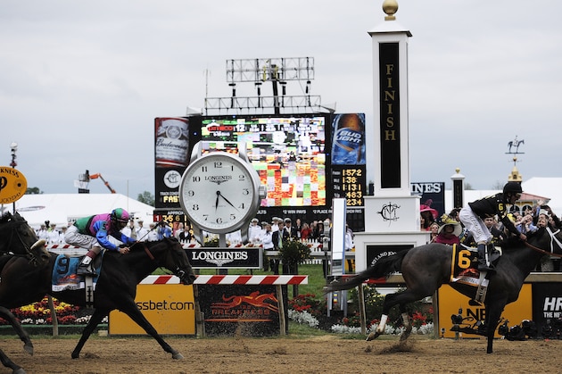 Oxbow, ridden by jockey Gary Stevens, wins the 138th Preakness Stakes horse race at Pimlico Race Course, Saturday, May 18, 2013, in Baltimore. Itsmyluckyday with John Velazquez aboard placers second. (AP Photo/Mike Stewart)