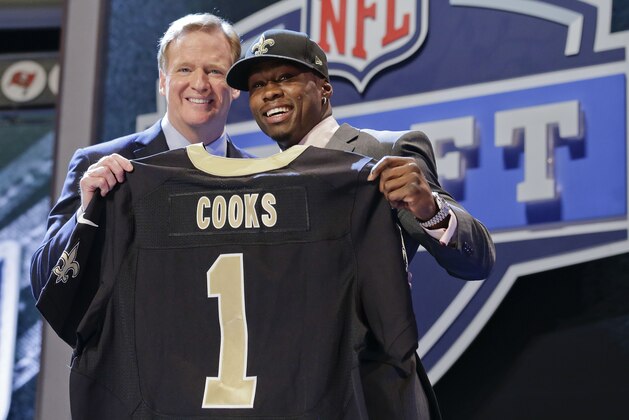 Oregon State wide receiver Brandon Cooks poses with NFL commissioner Roger Goodell after being selected by the New Orleans Saints as the 20th pick the first round of the 2014 NFL Draft, Thursday, May 8, 2014, in New York. (AP Photo/Craig Ruttle)