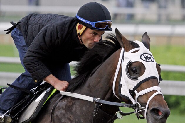 Exercise rider Joel Barrientos takes Kentucky Derby hopeful General a Rod for a morning workout at Churchill Downs Tuesday, April 29, 2014, in Louisville, Ky. (AP Photo/Garry Jones)