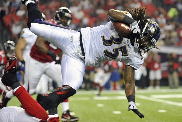 Baltimore Ravens running back Anthony Allen (35) flies over an Atlanta Falcons defender during the first half of an NFL preseason football game Thursday, Sept. 1, 2011, in Atlanta. (AP Photo/John Amis)