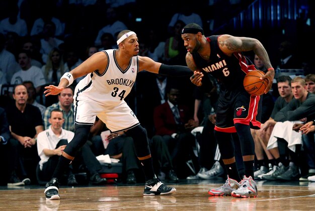 May 10, 2014; Brooklyn, NY, USA;  Brooklyn Nets forward Paul Pierce (34) guards Miami Heat forward LeBron James (6) during the third quarter in game three of the second round of the 2014 NBA Playoffs at Barclays Center. Brooklyn Nets won 104-90.  Mandatory Credit: Anthony Gruppuso-USA TODAY Sports