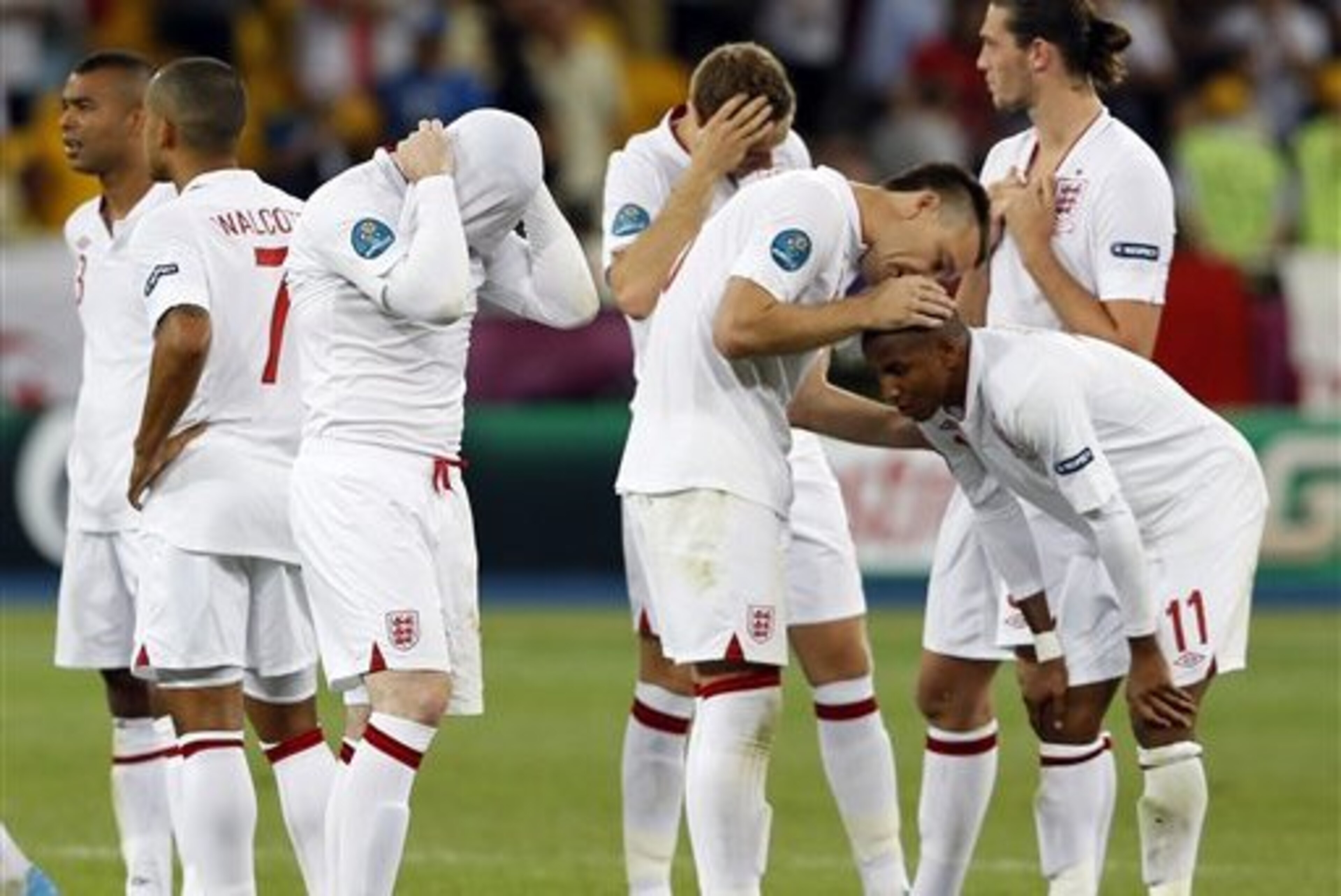 English players stand dejected after the penalty shootout during the Euro 2012 soccer championship quarterfinal match between England and Italy in Kiev, Ukraine, Monday, June 25, 2012. (AP Photo/Kirsty Wigglesworth) English players stand dejected after the penalty shootout during the Euro 2012 soccer championship quarterfinal match between England and Italy in Kiev, Ukraine, Monday, June 25, 2012. (AP Photo/Kirsty Wigglesworth)