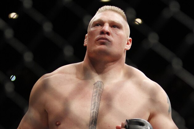 Brock Lesnar enters the ring just before his UFC heavyweight mixed martial arts match against Alistair Overeem of the Netherlands, Friday, Dec. 30, 2011 at The MGM Grand Garden Arena in Las Vegas. Overeem won by first round TKO and Lesnar announced his retirement after the fight. (AP Photo/Eric Jamison)