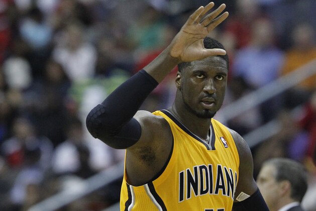 Indiana Pacers center Roy Hibbert (55) reacts to his score during the first half of Game 3 of an Eastern Conference semifinal NBA basketball playoff game against the Washington Wizards in Washington, Friday, May 9, 2014. (AP Photo/Alex Brandon)