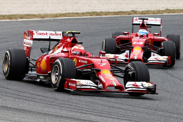 MONTMELO, SPAIN - MAY 11:  Kimi Raikkonen of Finland and Ferrari is followed by teammate Fernando Alonso of Spain and Ferrari during the Spanish Formula One Grand Prix at Circuit de Catalunya on May 11, 2014 in Montmelo, Spain.  (Photo by Clive Mason/Getty Images)