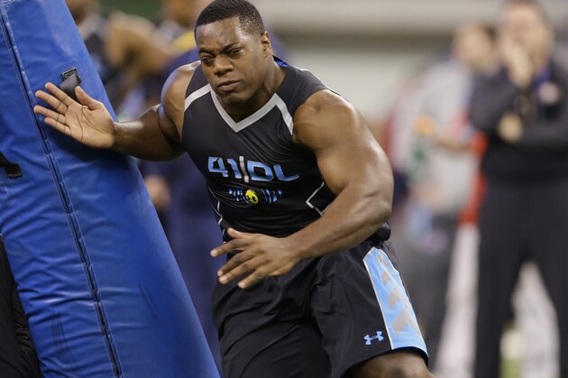 Princeton defensive lineman Caraun Reid runs a drill at the NFL football scouting combine in Indianapolis, Monday, Feb. 24, 2014. (AP Photo/Michael Conroy)