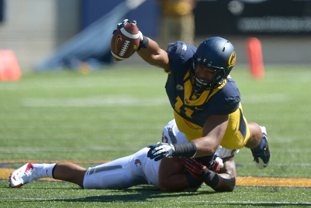 Oct 5, 2013; Berkeley, CA, USA; California Golden Bears receiver Richard Rodgers (11) is tackled by Washington State Cougars linebacker Cyrus Coen (42) at Memorial Stadium. Washington State defeated California 44-22. Mandatory Credit: Kirby Lee-USA TODAY Sports