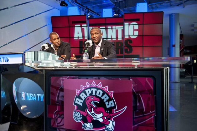Toronto Raptors president and general manager Masai Ujiri, left, and head coach Dwane Casey address the media during an NBA basketball news conference, Tuesday, May 6, 2014. Casey has agreed to a three-year contract extension after Toronto won a franchise-record 48 games this season. (AP Photo/The Canadian Press, Galit Rodan)