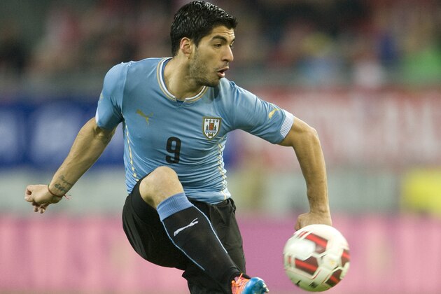 KLAGENFURT, AUSTRIA - MARCH 05:  Luis Suarez of Uruguay runs with the ball during the international friendly match between Austria and Uruguay at Woerthersee stadium on March 5, 2014 in Klagenfurt, Austria.  (Photo by Winnie Pessentheiner/Getty Images)