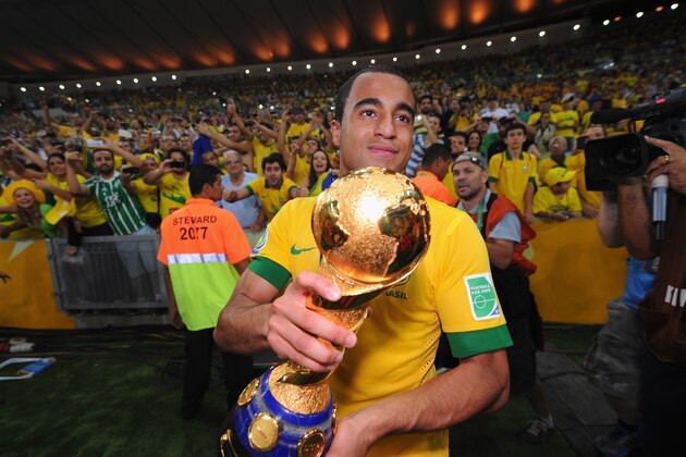 RIO DE JANEIRO, BRAZIL - JUNE 30:  Lucas Moura of Brazil celebrates with the trophy after the FIFA Confederations Cup Brazil 2013 Final match between Brazil and Spain at Maracana on June 30, 2013 in Rio de Janeiro, Brazil.  (Photo by Michael Regan/Getty Images)