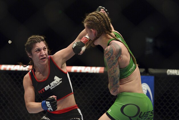 Apr 26, 2014; Baltimore, MD, USA;  Bethe Correia (left) lands a head shot on Jessamyn Duke during the second round  in UFC 172 at Baltimore Arena. Correia defeated Duke by judges decision.  Mandatory Credit: Tommy Gilligan-USA TODAY Sports