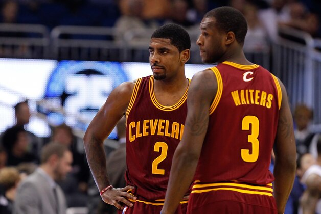Dec 13, 2013; Orlando, FL, USA; Cleveland Cavaliers point guard Kyrie Irving (2) and shooting guard Dion Waiters (3) against the Orlando Magic during the first quarter at Amway Center. Mandatory Credit: Kim Klement-USA TODAY Sports