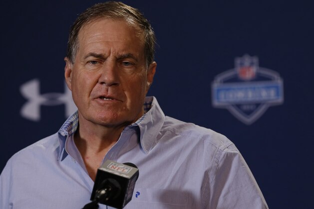 New England Patriots head coach Bill Belichick answers a question during a news conference at the NFL football scouting combine in Indianapolis, Thursday, Feb. 20, 2014. (AP Photo/Michael Conroy)