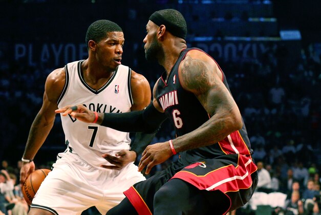 May 10, 2014; Brooklyn, NY, USA; Brooklyn Nets guard Joe Johnson (7) moves the ball around Miami Heat forward LeBron James (6) during the third quarter in game three of the second round of the 2014 NBA Playoffs at Barclays Center. Brooklyn Nets won 104-90.  Mandatory Credit: Anthony Gruppuso-USA TODAY Sports
