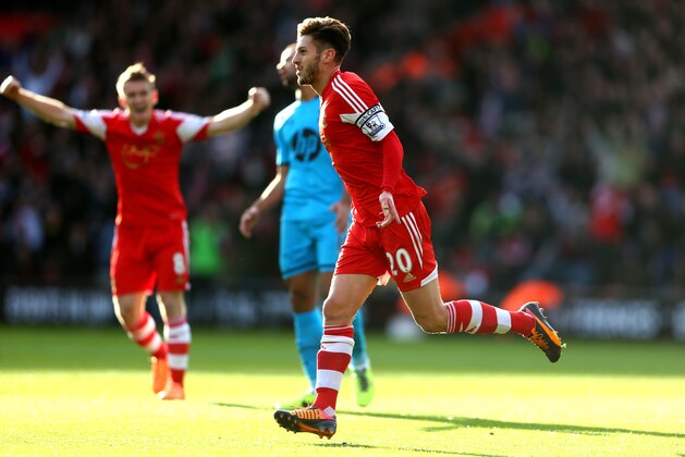 SOUTHAMPTON, ENGLAND - DECEMBER 22:  Adam Lallana of Southampton celebrates after scoring the opening goal during the Barclays Premier League match between Southampton and Tottenham Hotspur at St Mary's Stadium on December 22, 2013 in Southampton, England.  (Photo by Paul Gilham/Getty Images)