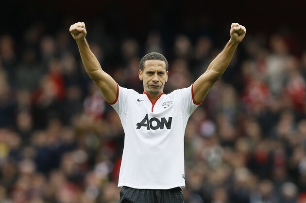 Manchester United's Rio Ferdinand celebrates towards the fans after the English Premier League soccer match between Arsenal and Manchester United at the Emirates Stadium in London, Sunday, April 28, 2013. (AP Photo/Kirsty Wigglesworth)