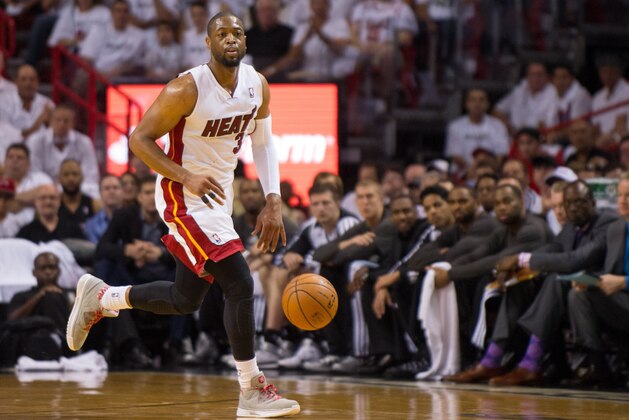 May 6, 2014; Miami, FL, USA; Miami Heat guard Dwyane Wade (3) dribbles against the Brooklyn Nets during the first half in game one of the second round of the 2014 NBA Playoffs at American Airlines Arena. Mandatory Credit: Steve Mitchell-USA TODAY Sports