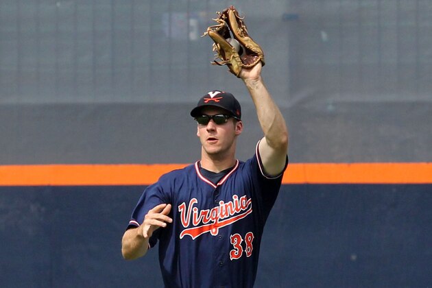 Virginia's Mike Papi makes a catch in the eighth inning of an NCAA super regional college baseball game in Charlottesville, Va., Monday, June 10, 2013. Mississippi State defeated Virginia 6-5 advancing to the College World Series. (AP Photo/Andrew Shurtleff)