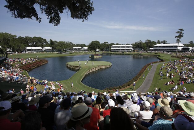 Golfers play the 17th hole during the second round of The Players championship golf tournament at TPC Sawgrass, Friday, May 9, 2014, in Ponte Vedra Beach, Fla. (AP Photo/John Raoux)