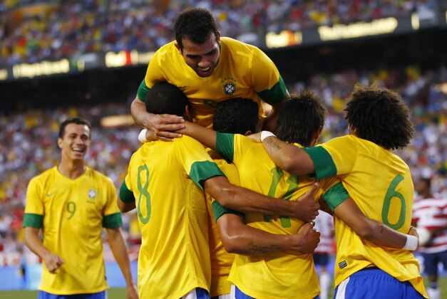 May 30, 2012; Landover, MD, USA; Brazil forward Neymar (11) celebrates with teammates after scoring a goal on a penalty kick against the USA in the first half at FedEx Field. Mandatory Credit: Geoff Burke-USA TODAY Sports