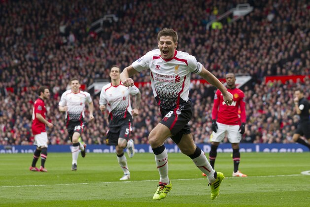 Liverpool's Steven Gerrard celebrates after scoring against Manchester United during their English Premier League soccer match at Old Trafford Stadium, Manchester, England, Sunday March 16, 2014. (AP Photo/Jon Super)