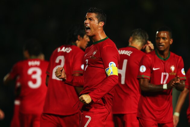 BELFAST, NORTHERN IRELAND - SEPTEMBER 06:  Cristiano Ronaldo of Portugal celebrates scoring during the FIFA 2014 World Cup Qualifying Group F match between Northern Ireland and Portugal at Windsor Park on September 6, 2013 in Belfast, Northern Ireland.  (Photo by Bryn Lennon/Getty Images)