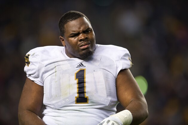 Nov 9, 2013; Pittsburgh, PA, USA; Notre Dame Fighting Irish nose tackle Louis Nix (1) walks to the sideline in the third quarter against the Pittsburgh Panthers at Heinz Field. Pitt won 28-21. Mandatory Credit: Matt Cashore-USA TODAY Sports