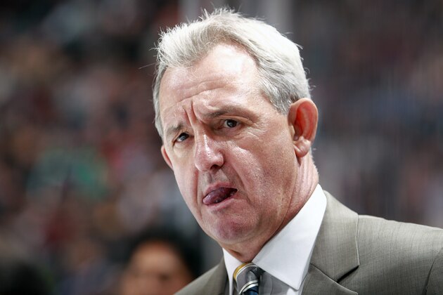 VANCOUVER, BC - APRIL 5:  Head coach Darryl Sutter of the Los Angeles Kings looks on from the bench during their NHL game against the Vancouver Canucks at Rogers Arena April 5, 2014 in Vancouver, British Columbia, Canada.  Vancouver won 2-1. (Photo by Jeff Vinnick/NHLI via Getty Images)