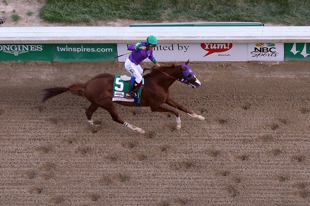 LOUISVILLE, KY - MAY 03:  California Chrome with Victor Espinoza up crosses the finish line to win the 140th running of the Kentucky Derby at Churchill Downs on May 3, 2014 in Louisville, Kentucky.  (Photo by Jamie Squire/Getty Images)