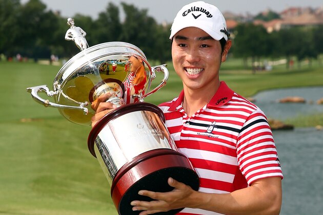 IRVING, TX - MAY 19:  Sang-Moon Bae of South Korea celebrates with the championship trophy after winning the 2013 HP Byron Nelson Championship at the TPC Four Seasons Resort on May 19, 2013 in Irving, Texas.  (Photo by Tom Pennington/Getty Images)