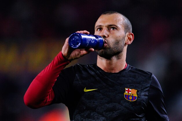 BARCELONA, SPAIN - DECEMBER 11:  Javier Mascherano of FC Barcelona drinks water during the Champions League Group H match between FC Barcelona and Celtic FC at Camp Nou on December 11, 2013 in Barcelona, Spain.  (Photo by David Ramos/Getty Images)
