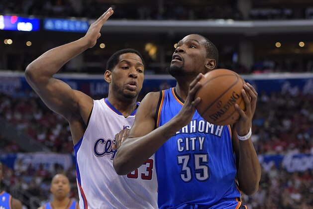 Oklahoma City Thunder forward Kevin Durant, right, goes up for a shot as Los Angeles Clippers forward Danny Granger defends in the second half of Game 4 of the Western Conference semifinal NBA basketball playoff series, Sunday, May 11, 2014, in Los Angeles. The Clippers won 101-99. (AP Photo/Mark J. Terrill)