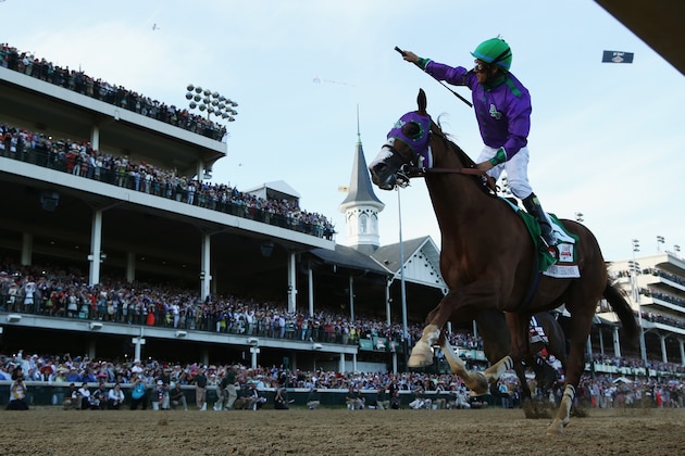 LOUISVILLE, KY - MAY 03:  Jockey Victor Espinoza celebrates atop of California Chrome #5 after crossing the finish line to win the 140th running of the Kentucky Derby at Churchill Downs on May 3, 2014 in Louisville, Kentucky.  (Photo by Matthew Stockman/Getty Images)