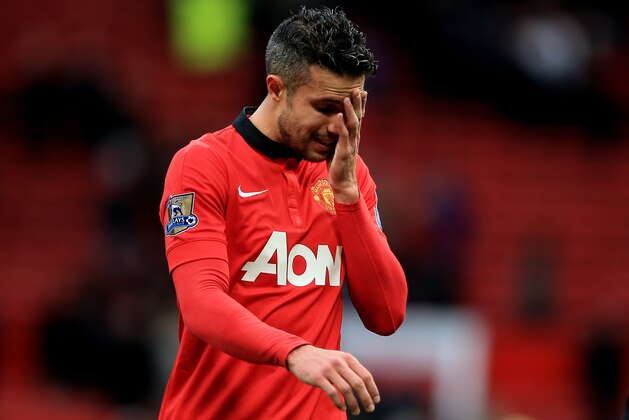 MANCHESTER, ENGLAND - DECEMBER 07:  A dejected Robin van Persie of Manchester United walks off the pitch following his team's 1-0 defeat during the Barclays Premier League match between Manchester United and Newcastle United at Old Trafford on December 7, 2013 in Manchester, England.  (Photo by Richard Heathcote/Getty Images)