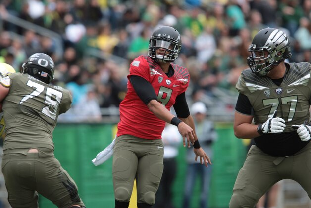 May 3, 2014; Eugene, OR, USA; Oregon Ducks quarterback Marcus Mariota (8) throws the ball at Autzen Stadium. Mandatory Credit: Scott Olmos-USA TODAY Sports